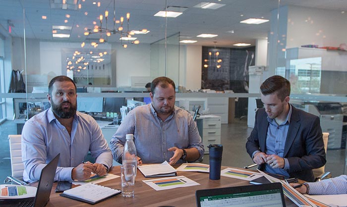 Frontline Real Estate Services founding partner, Justin Mitchell with colleagues Adam Lawrence and Mike Harrison (left to right) who were both hired using light personality testing.